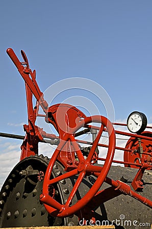 Levers, gauge, and steering wheel of a steam engine Stock Photo