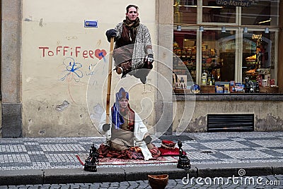 Levitating man illusion in Prague street Editorial Stock Photo