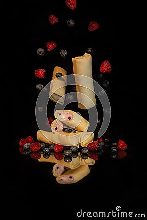 Levitation of pancakes with cottage cheese and berries Stock Photo