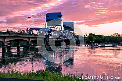 Lewiston - Clarkston blue bridge against vibrant twilight sky. Idaho and Washington states border Stock Photo