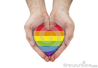 LGBT rainbow heart symbol of love in hands Stock Photo