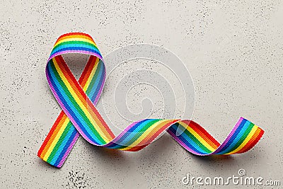 LGBT rainbow ribbon pride symbol. Stop homophobia. Grey background Stock Photo