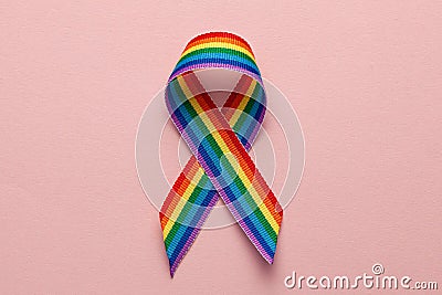LGBT rainbow ribbon pride symbol. Stop homophobia. Pink background Stock Photo