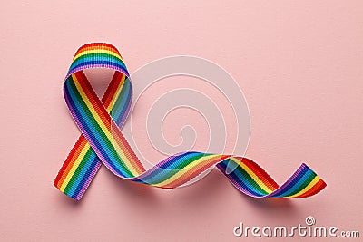 LGBT rainbow ribbon pride symbol. Stop homophobia. Pink background Stock Photo