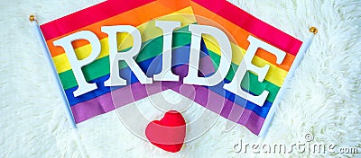 LGBTQ Rainbow flag on white background. Support Lesbian, Gay, Bisexual, Transgender and Queer community and Pride month concept Stock Photo