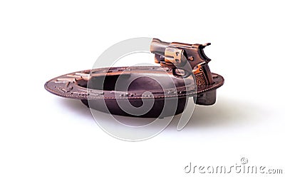 Lighter in the form of the gun and an ashtray Stock Photo
