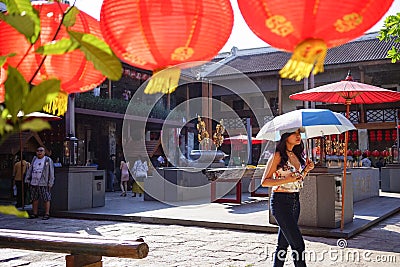 Lhong 1919, a girl with umbrella walk around place Editorial Stock Photo