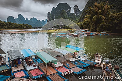 Li River Lijiang River. Pleasure boats at the pier in Xingping Editorial Stock Photo