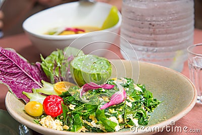 Liang leaves fried egg in dish brown on table. Stock Photo