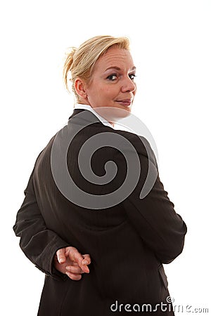 Liar businesswoman with crossed fingers at back Stock Photo