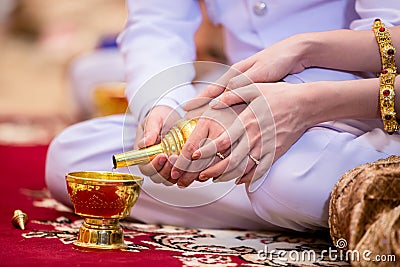 libation, Thai engagement, pour water in Thai wedding, Stock Photo