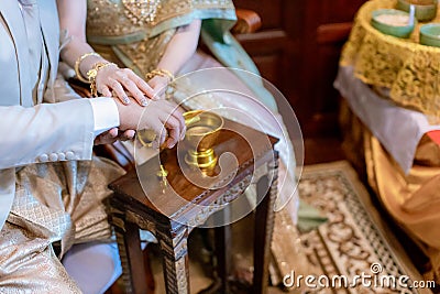 libation, Thai engagement, pour water in Thai wedding, pouring water in Thai wedding. Stock Photo