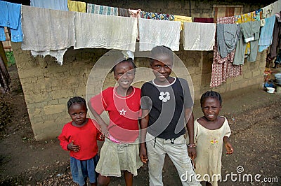 Liberian Children in Front of Hut Editorial Stock Photo
