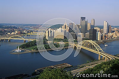 Liberty Bridge over Allegheny River at sunset with Pittsburgh skyline, PA Stock Photo
