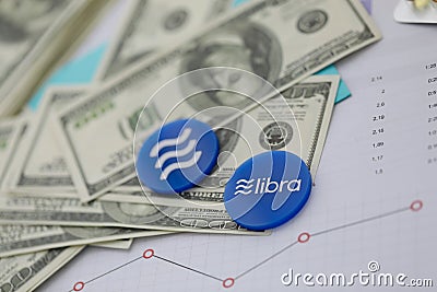 Libra blue cryptocyrrency coin lie on table Editorial Stock Photo