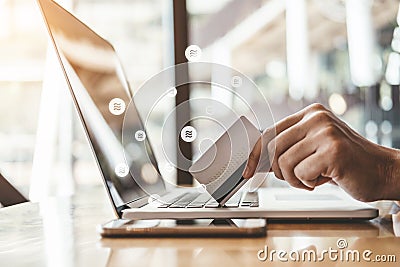 Libra Cryptocurrency Online banking businessman using Laptop with credit card online shopping , Fintech and Blockchain concept Editorial Stock Photo