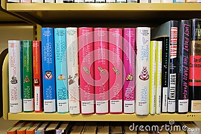 Library books shelf for novels by Joanne Fluke Editorial Stock Photo