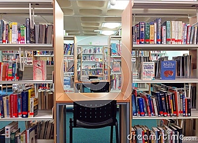 Library books on shelves and study area. Editorial Stock Photo