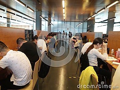 Shenzhen, China: library, male and female readers are reading Editorial Stock Photo