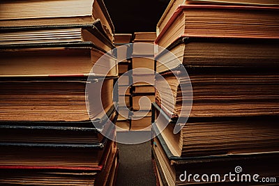 Library stack of old books. Rows in antique shop, bookstore. Vintage literature. Stock Photo