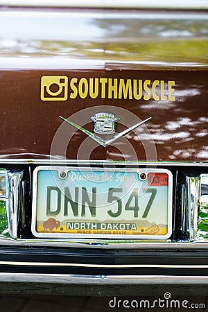 license plate. part of Retro Cadillac car at the exhibition of vintage cars. Editorial Stock Photo