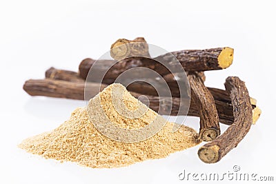 Licorice powder and roots - Glycyrrhiza glabra - White background Stock Photo