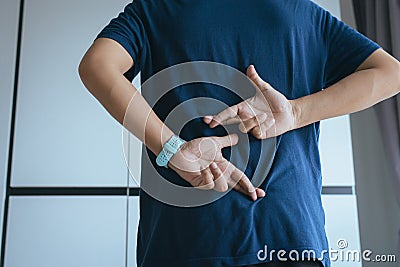 Lie of man with hand crossing fingers behind back telling liar and cheating,April Fools` Day concept Stock Photo