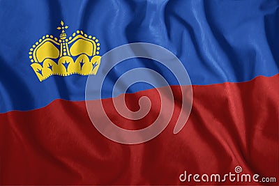 The Liechtenstein flag flies in the wind. Colorful, national flag of Liechtenstein. Patriotism. Stock Photo