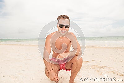 Life guard sitting on the beach Stock Photo