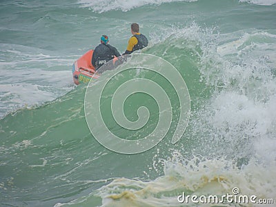 Life guards on heaving ocean Editorial Stock Photo