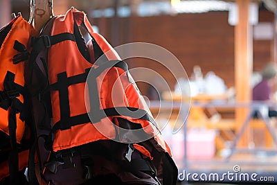 Life jacket hanging in floating hotel houses Stock Photo