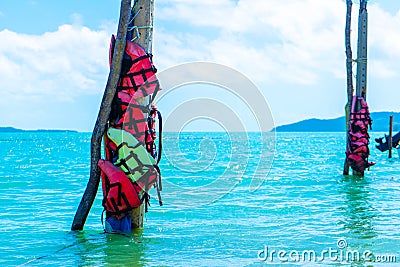 Life jackets are attached to pillars at sea. Buoys for which it is not recommended to swim Stock Photo