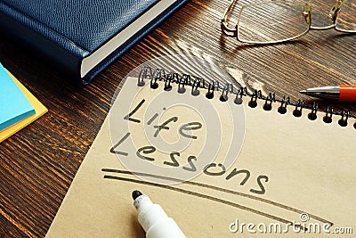 Life lessons handwritten on the page and glasses. Stock Photo