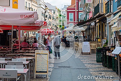 Daily life in one of the most popular neighborhood in Lisbon, Almada Editorial Stock Photo