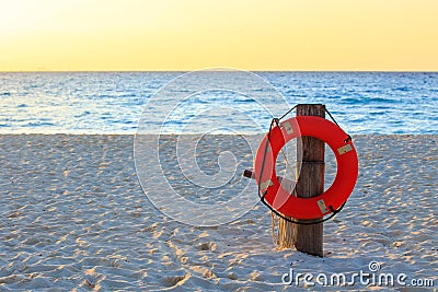 Life preserver on sandy beach Stock Photo