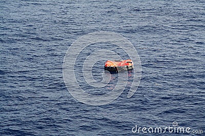 Life Raft adrift on the Ocean Stock Photo