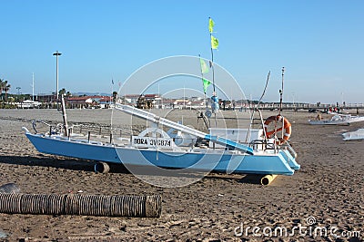 A life raft. a boat stranded or parked on the sandy beach in broad daylight Editorial Stock Photo