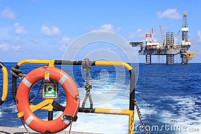 Life ring on the offshore supply boat with Jack up drilling rig Stock Photo