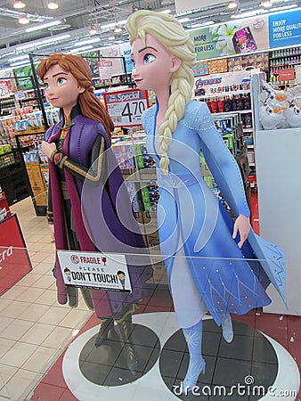 Life sized figures of Princess Elsa and Anna from the Disney animation movie Frozen at a departmental store Editorial Stock Photo