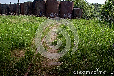 Old railroad overgrown with grass Stock Photo