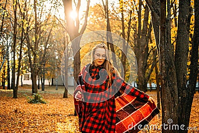 Life Style Portrait of Happy Woman in fall park. Beautiful girl on the nature picnic camping. Relaxing Girl in autumn Nature. Stock Photo