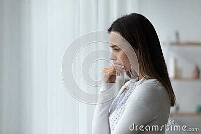 Pensive sad woman standing thinking over problems search solution Stock Photo