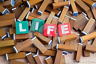 Life word inside the colorful text box on brown wood stamper Stock Photo