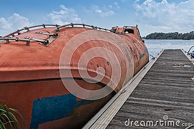 Lifeboat docked at pontoon. Rio zaire. Africa Stock Photo