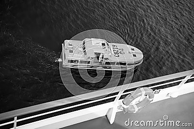 Lifeboat or orange boat on blue sea water, top view Editorial Stock Photo