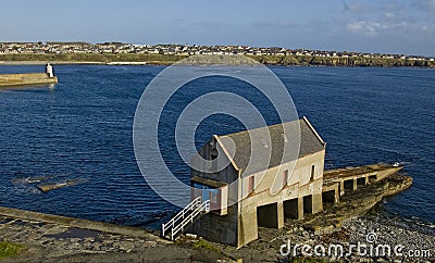 Old Lifeboat station and Lighthouse at Wick Harbour, Caithness,Scotland.UK. Stock Photo