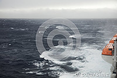 Lifeboats and rough seas Stock Photo