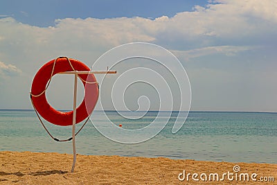 Lifebuoy on the beach. Stock Photo