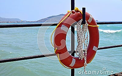 Lifebuoy hanging on the hook Stock Photo