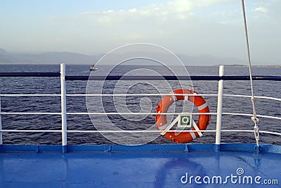 Lifebuoy and the sea in a ferryboat going from Antirio to Rio in Greece Stock Photo